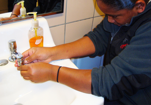 student replacing bathroom faucet aeratorsu