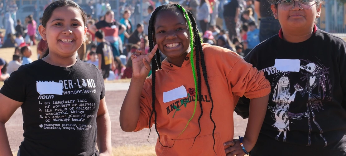 Students smiling at a water festival