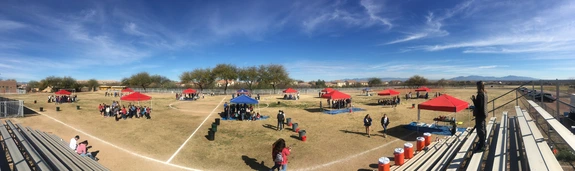 Field with canopies set-up showing how a water festival day looks.