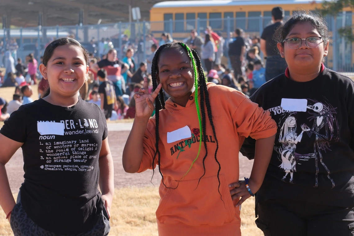 Students smiling at a water festival